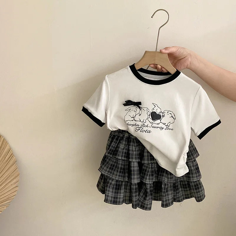 Girls' Summer Clothing New Korean Bow Cartoon Short Sleeved 2025 Lace Checkered Versatile Cake Skirt Two-piece Set